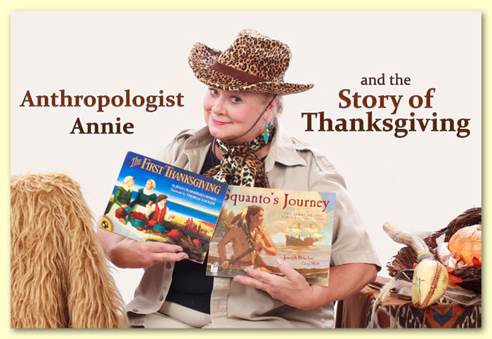 Photo of Anthropologist Annie holding up 2 books