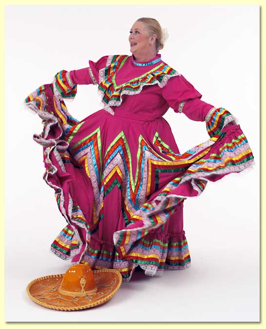 Large photograph of Margret Clowder in a Mexican dress draped in ribbons.
