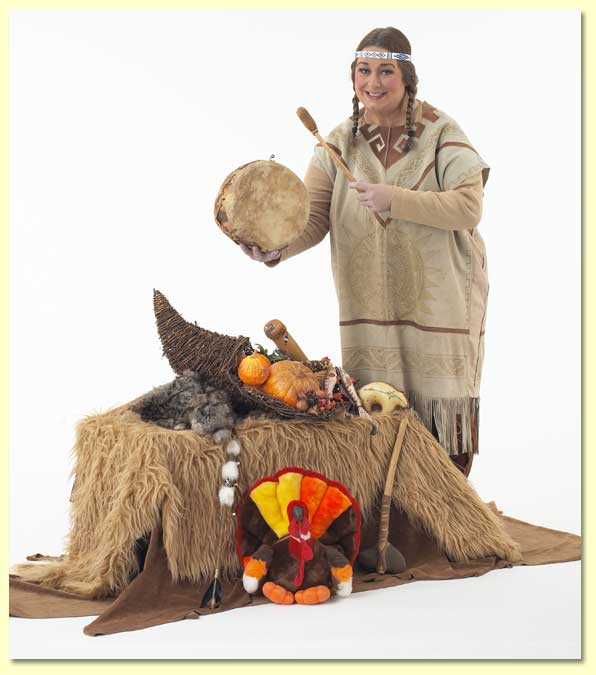 Photo of Singing Bird the Native American with animal skins, a turkey puppet, and more examples of Indian culture.