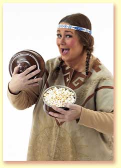 Thumbnail picture of Margaret Clauder as Singing Bird, showing popcorn created by magic.