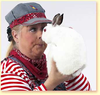 Picture of Engineer Maggie, a character for the 2010 Summer Reading program for the Texas library association, holding the star of the show, a white bunny.