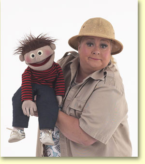 Photo of Margaret Clauder, ventriloquist, with Elmer, a hand puppet.