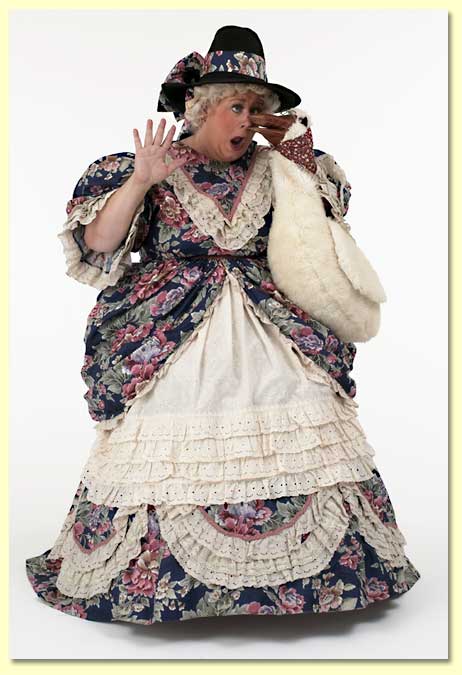 Picture of Mother Goose (played by Margaret Clauder) with Goosie the hand puppet pecking her nose.